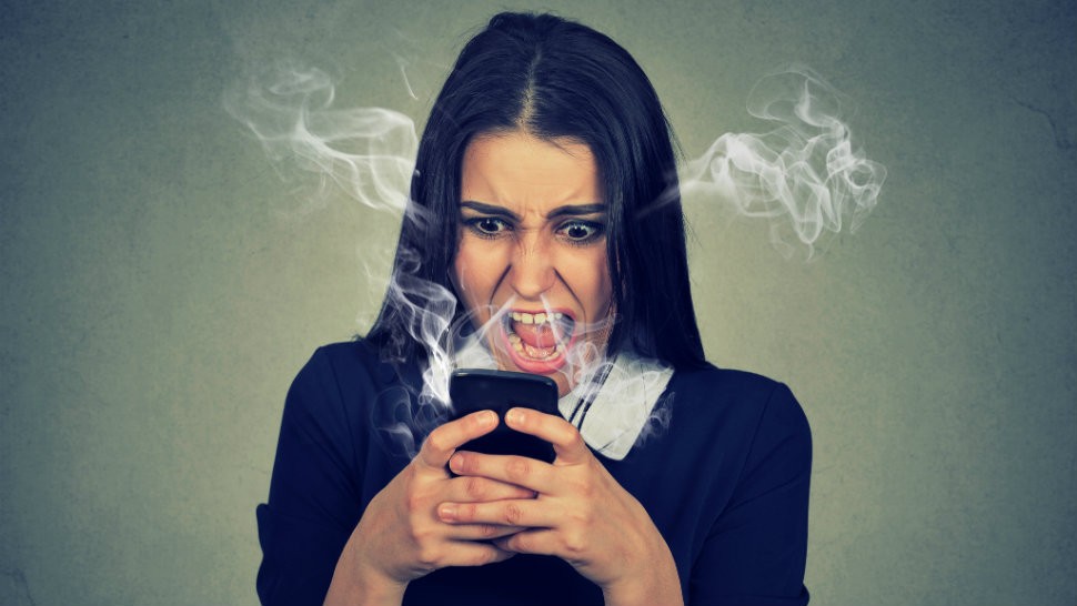 angry woman at robocalls and robotexts